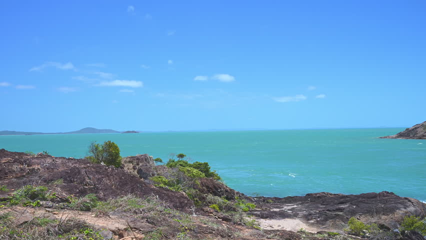 slow motion of you are standing at the northernmost point of the australian continent sign at the tip of Cape York along the coastline of the torres strait in tropical north Queensland, Australia.