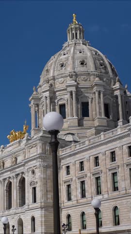 Watch the State Capitol in St Paul Minnesota shown from various angles under bright skies with clear details of the architecture.