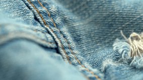 Close up of torn denim fabric texture with frayed threads - Powered by Shutterstock - Get 15% off with code: PIKWIZARD15