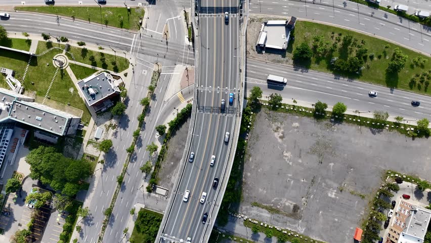 Aerial view of Montreal city skyline and the Jacques Cartier Bridge over the St. Lawrence with downtown in the background. g