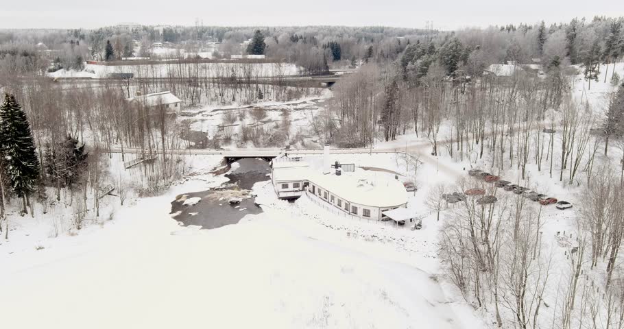 Aerial view of Vantaankoski rapids and Vanha Viilatehdas (The Old File Factory), which now operates as a restaurant and event venue in cloudy winter weather, Vantaa, Finland, Europe.