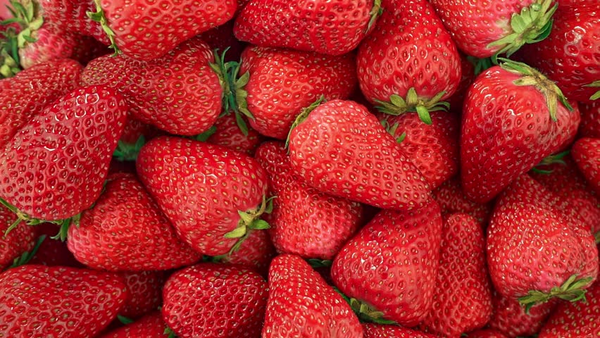 Macro Close-up of Fresh Red Strawberries Falling and Piling Up, Vibrant Ripe Berries Background for Food Advertising, Organic Fruit