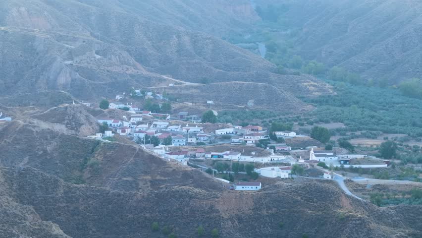 Aerial view of the small village of Gorafe, a tranquil white town nestled in the arid hills and canyons of the Granada badlands, Spain