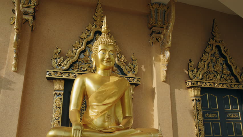 Golden Buddha statue inside temple at Big Buddha complex Koh Samui Thailand.