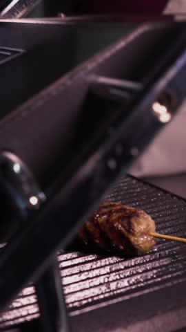 Juicy sausages grilled on the grill