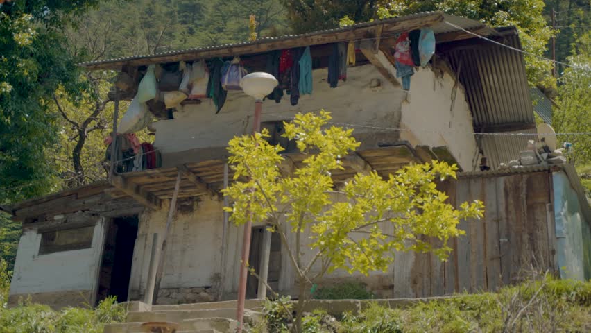 Traditional rural house in a mountain village in India, capturing countryside lifestyle, local culture and peaceful natural surroundings.