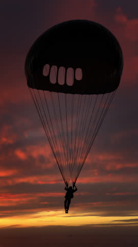 Man flying with parachute high in the sky as silhouette appears against glowing sunrise horizon