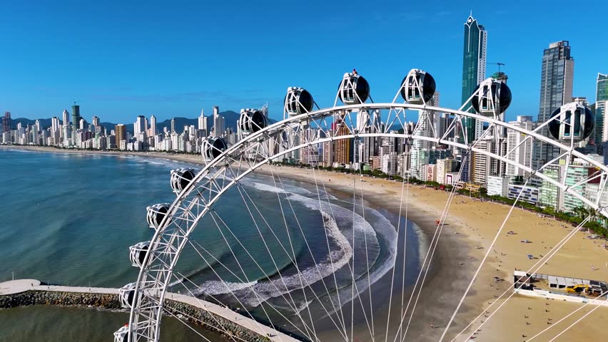 Ferris Wheel With Balneario Camboriu City Skyline and the Beach