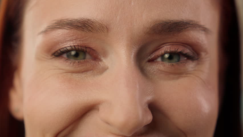 Close up Caucasian business woman opening eyes in office smiling joyful businesswoman makeup beauty face portrait female entrepreneur manager happy laughing girl employee healthy toothy smile indoors