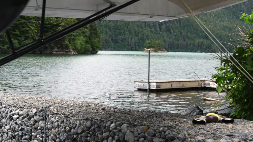 Plane Moored Near Dock On A Lake In Cordova Alaska