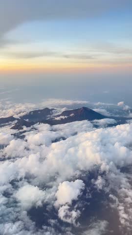 Aerial Sunrise Above Clouds Over Indonesian Volcano Landscape