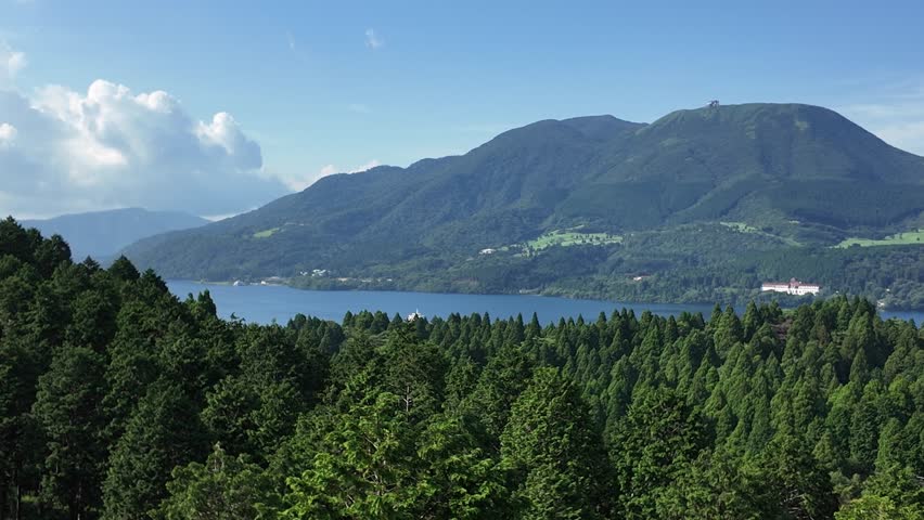 Panoramic summer view of Lake Ashi and Mount Hakone under blue sky Japan 4K