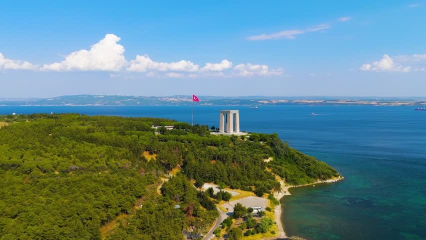 Eceabat, Turkey. Dardanelles Strait, coastline, Canakkale Martyrs Memorial, Turkish flag, Hisarlik Hill, clear day, drone. Stable. Aerial View. Rich colors