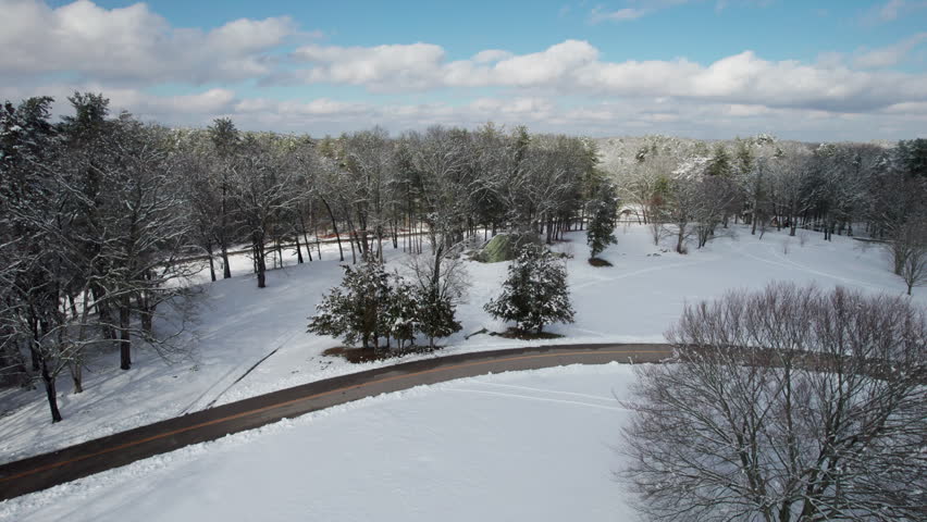 Aerial view of beautiful snow covered tress in a local park in Rhode Island.