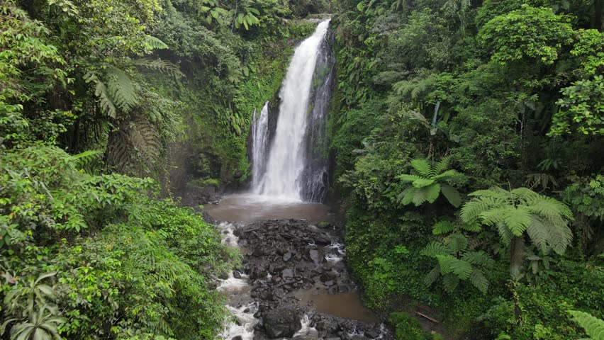 Beautiful Waterfall in the Middle of Forest, Aerial View of Nature from Above