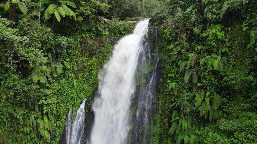 Beautiful Waterfall in the Middle of Forest, Aerial View of Nature from Above