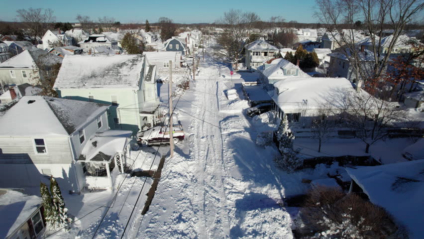 Aerial view of the blizzard of 2026 in Cranston, Rhode Island with impassable roads and snow covered roof tops.