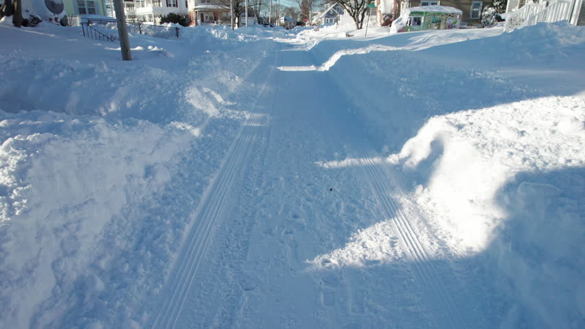 Aerial view of the blizzard of 2026 in Cranston, Rhode Island with impassable roads and snow covered roof tops.
