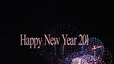 Happy New Year 2014 text animation with fireworks display in the background