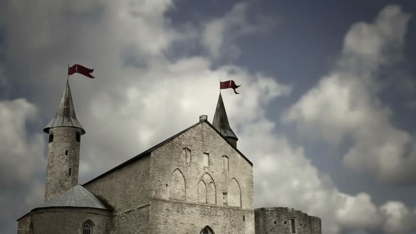 Digitally created medieval castle or church with timelapse clouds in a dark version, showcasing atmospheric skies and historic architecture in motion.