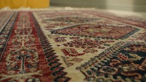 Detailed view traditional persian rug with intricate floral patterns, ornate borders, showing rich texture and colorful handmade craftsmanship of classic oriental textile. Traditional persian carpet. - Powered by Shutterstock - Get 15% off with code: PIKWIZARD15