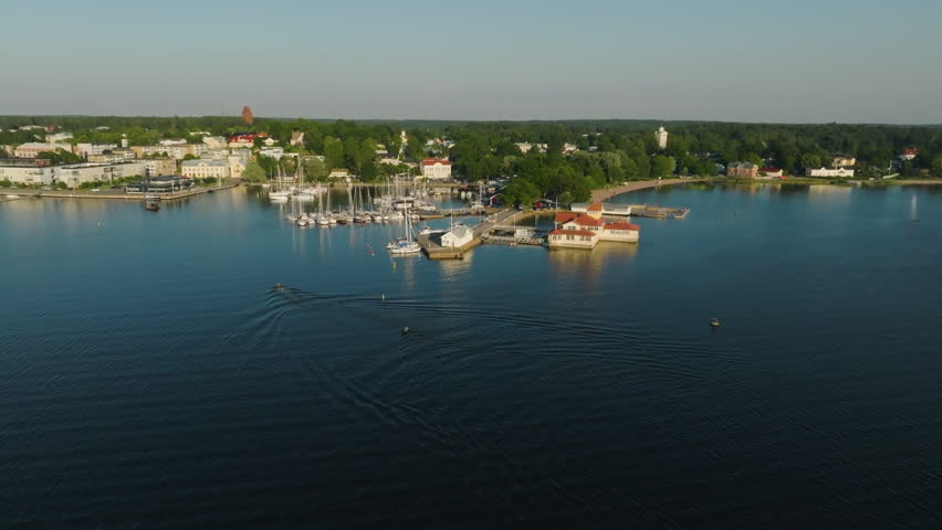Aerial view of water scooters arriving in Tammisaari city, summer eve in Finland