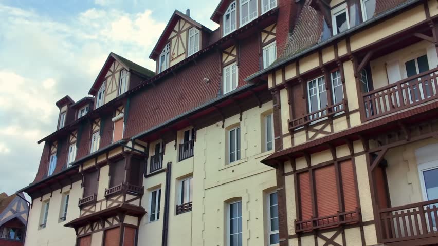 Row of traditional Normandy houses in Etretat with timber and brick facades