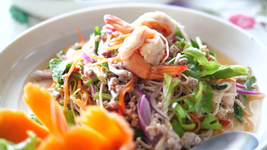 Healthy Thai glass noodle salad with fresh shrimp and vegetables for spicy food and asian cuisine concept