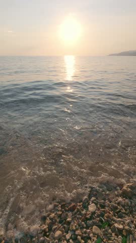 Sunset Over Calm Ocean Water