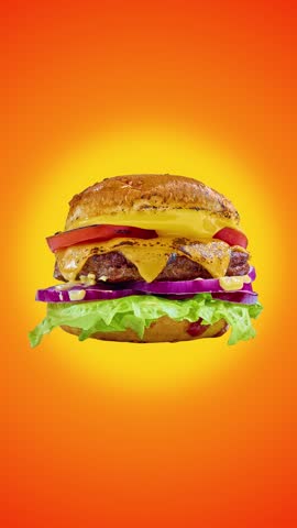 Floating burger with separated ingredients bursting in air on vibrant orange background. Concept of fast food promotion, menu advertising, product showcase, and delivery services.