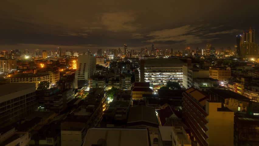 Timelapsing view of skyline with urban buildings in Bangkok, Thailand.