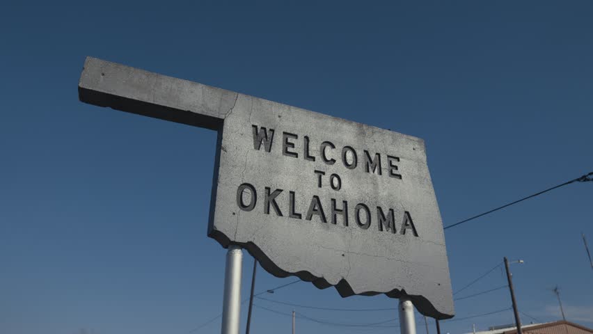 Gray Concrete Engraved Welcome to Oklahoma Sign at State Border 