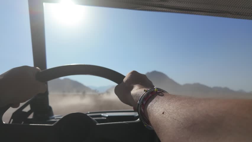 Adventure safari while driving a car in the charming and dusty desert near Sharm El Sheikh, South Sinai, Egypt
