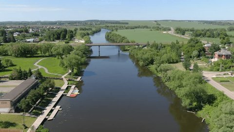Forward Drone Flight along River Bridge