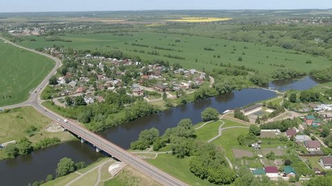 Aerial Descent Side Rotation above River Fields