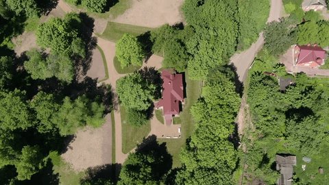Drone Flying Backward Ascending over Rural Landscape