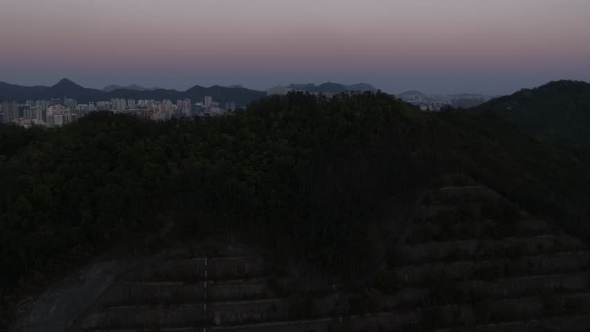 Aerial view revealing hong kong cityscape at sunset