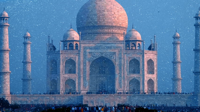 Front view of Taj Mahal - ivory-white marble mausoleum with minarets on the sides commissioned by Shah Jahan. The most romantic building in the world. Agra, Uttar Pradesh, India. View through sparkling particles. Shot in motion