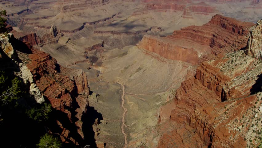 This 4K video captures the Grand Canyon in Arizona. The visual documents the steep-sided gorge and distinct rock layers carved by the Colorado River. The composition illustrates the Lipan Point and Mohave Point viewpoints, documenting Colorado Plateau geomorphology and millions of years of Earth