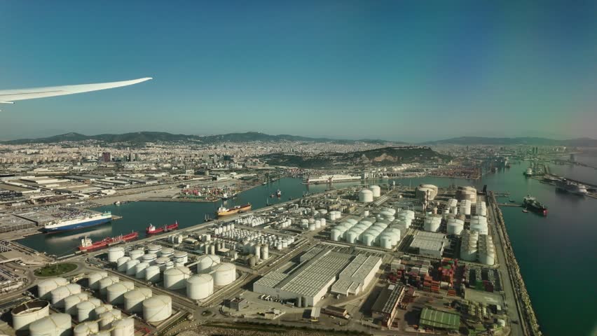 Cruise ship near oil tanks industrial Barcelona port