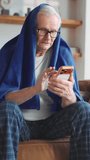 Elderly man using modern smartphone for communication or looking for information in internet about illness and curing influenza. Telemedicine service online, healthcare for senior people, mobile app - Powered by Shutterstock - Get 15% off with code: PIKWIZARD15
