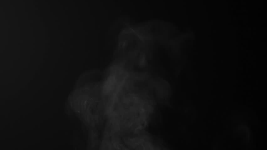 Steam, smoke, vapor isolated on black background. Smoke steam spray, abstract vaporing water, texture of cold mist, hot vapor, fog effect closeup, black screen. Hot food, drink. Slow motion  