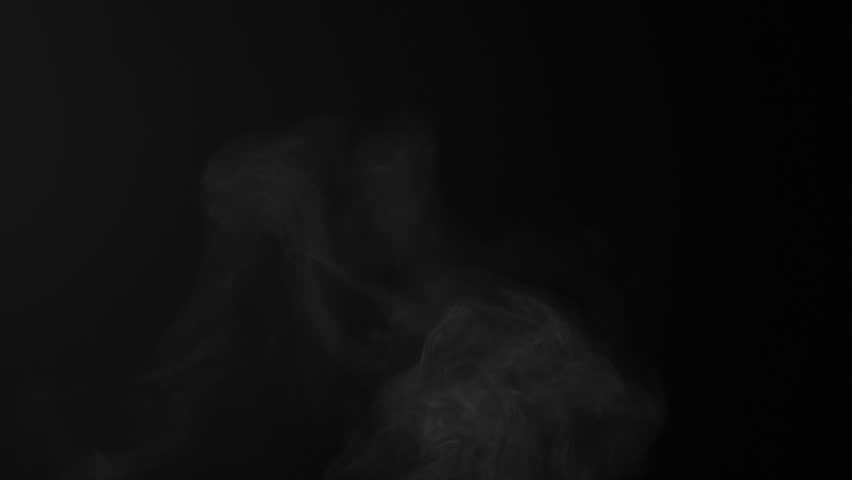 Steam, smoke, vapor isolated on black background. Smoke steam spray, abstract vaporing water, texture of cold mist, hot vapor, fog effect closeup, black screen. Hot food, drink. Slow motion  