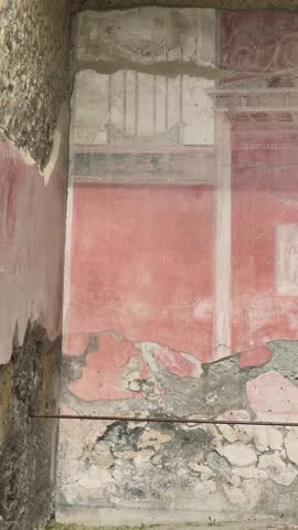 Herculaneum excavations with ancient frescoes, mosaics, and decorations in Roman villas preserved by the eruption of Mount Vesuvius, showcasing art and daily life in Italy.