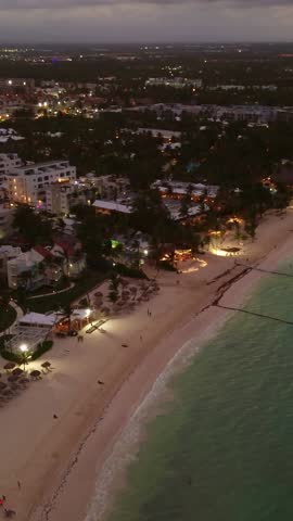 Popular tourist coastline at dusk, city lights