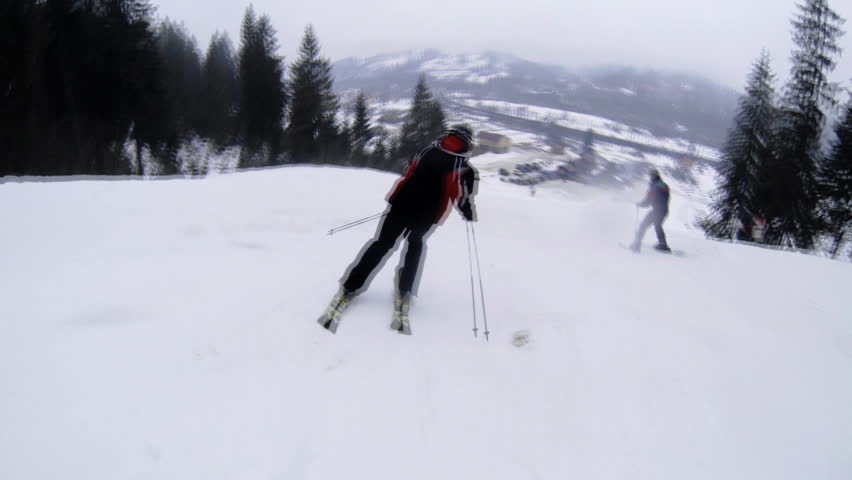 Motion camera view of skier is riding in the mountains.