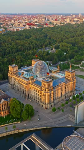  Aerial view of Reichstag in Berlin and Government Buildings and central park at sunrise, Germany