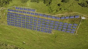 Drone footage of solar panels installed in lush green mountains for electricity and lighting. Highlights sustainable energy, rural infrastructure, and eco-friendly technology. - Powered by Shutterstock - Get 15% off with code: PIKWIZARD15