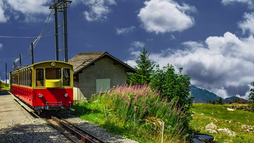SANKT MORITZ - July 2016 - Rhaetian Railway train passing a bridge viaduct in summer through the line of Glacier Express from Zermatt to Sankt Moritz, Switzerland, UNESCO World Heritage Site, Europe Bernina Express, red train of Bernina and glacier of Morteratsch in the Swiss Alps. Unesco World Heritage ZERMATT - SWITZERLAND, September 26, 2018:  A train on the Gornergrat bahn and the famous Matterhorn.