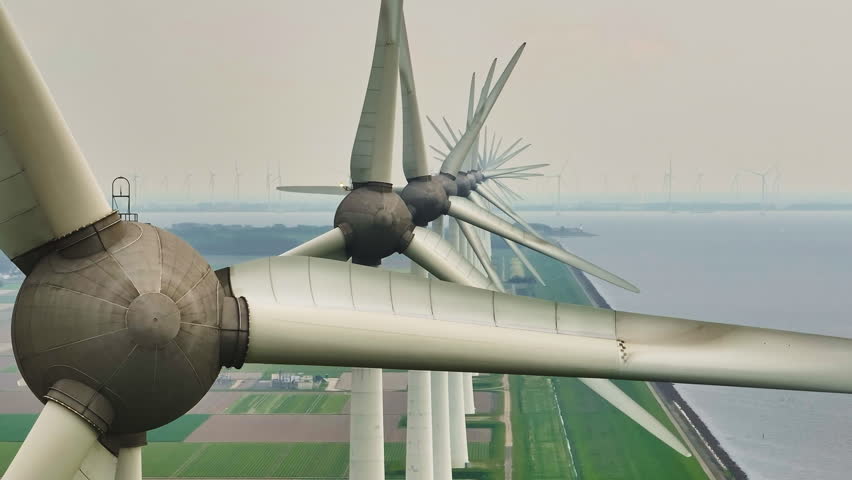 Aerial view of offshore windmill park with blue sky, windmill park in the sea, aerial view of wind turbine, Netherlands